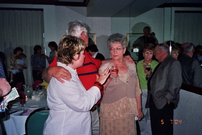 We were standing around waiting on my mother to arrive.  This my sister, uncle, and aunt.  My aunt's husband is standing behind her holding a glass of wine and talking to a women in a green shirt.